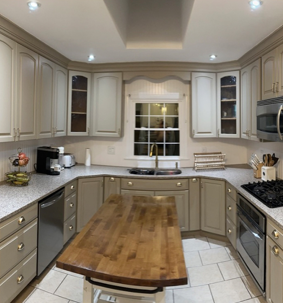 Interior of spectacular white and beige kitchen with elegant style